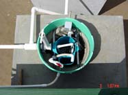 A view of the pump chamber including vault,
         splice box and connectors.